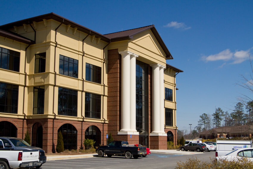 Large window and columned entrance to Lakeside Commons